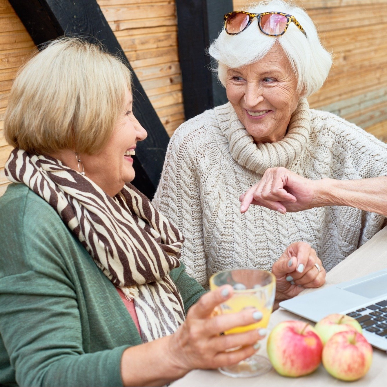 two ladies on a laptop